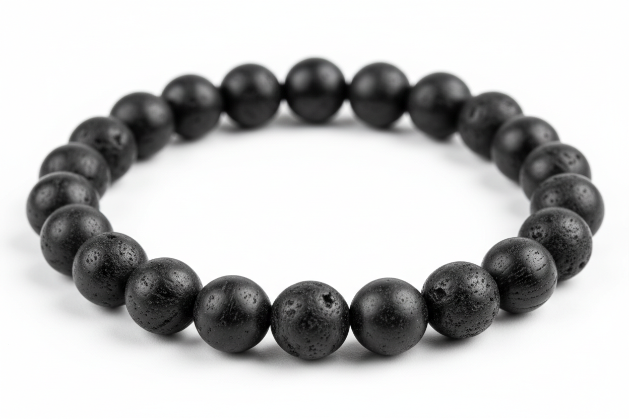 Create a premium product image of a **Black Tourmaline Protection Bracelet** made with natural black tourmaline grounding beads. Arrange the bracelet neatly in a circular shape on a clean white background with soft shadows. Highlight the matte black stone texture and strong negative-energy shi