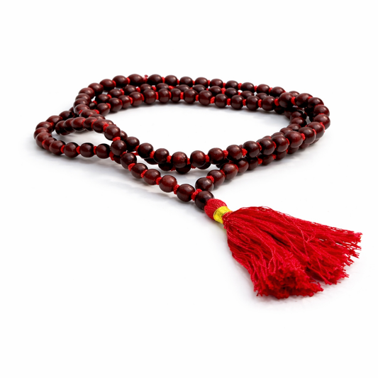 Dhivarashi red wooden beaded mala necklace with smooth round beads and red tassel on white background