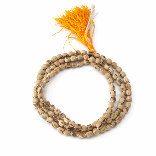 Dhivarashi Tulsi wood mala necklace with natural wooden beads and saffron tassel on white background