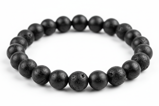 Create a premium product image of a **Black Tourmaline Protection Bracelet** made with natural black tourmaline grounding beads. Arrange the bracelet neatly in a circular shape on a clean white background with soft shadows. Highlight the matte black stone texture and strong negative-energy shi
