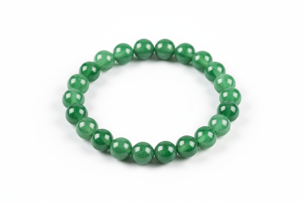 Create a premium product image of a **Green Jade Good Luck Bracelet** made with natural green jade beads. Arrange the bracelet neatly in a circular shape on a clean white background with soft shadows. Highlight the smooth green stone texture and its harmony, prosperity, and good-fortune Feng Shui energy. 1:1 square image.
