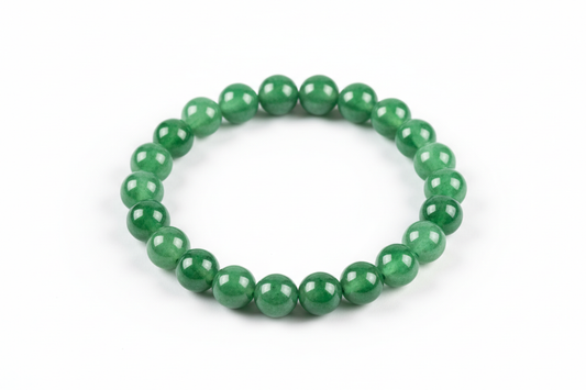 Create a premium product image of a **Green Jade Good Luck Bracelet** made with natural green jade beads. Arrange the bracelet neatly in a circular shape on a clean white background with soft shadows. Highlight the smooth green stone texture and its harmony, prosperity, and good-fortune Feng Shui energy. 1:1 square image.
