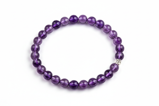 Create a premium product image of a **Reiki Healing Crystal Bracelet** made with natural Amethyst purple beads. Arrange the bracelet neatly in a circular shape on a clean white background with soft shadows. Highlight the deep purple tones and meditation, chakra balancing energy. 1:1 square image.
