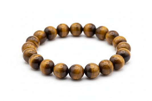Create a premium product image of a **Tiger Eye Confidence Bracelet** made with natural golden-brown tiger eye beads. Arrange the bracelet neatly in a circular shape on a clean white background with soft shadows. Highlight the glossy tiger eye shine and its courage, strength, willpower, and focus energy. 1:1 square image.
