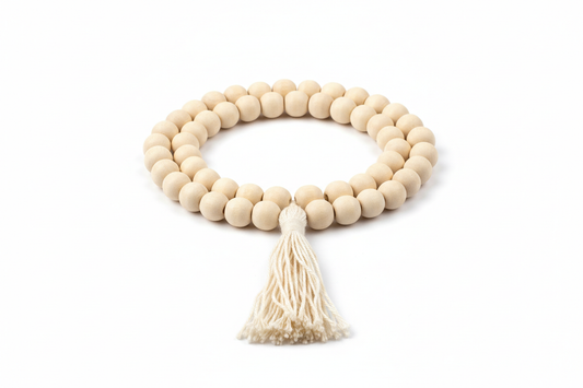Create a premium product image of a **White Chandan Mala 8mm** with natural sandalwood beads and a thread latkan. Arrange the mala neatly in a clear circular shape on a clean white background with soft shadows. Highlight the smooth light-wood texture and cooling meditation energy. 1:1 square image.
