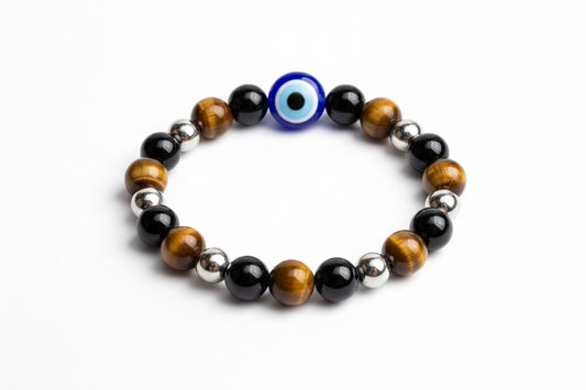 Create a premium product image of an **Evil Eye Protection Bracelet** made with Tiger Eye, Obsidian, Hematite, and a central Evil Eye bead. Arrange the bracelet neatly in a circular shape on a clean white background with soft shadows. Highlight the glossy stone textures and strong negative-energy protection vibe. 1:1 square image.
