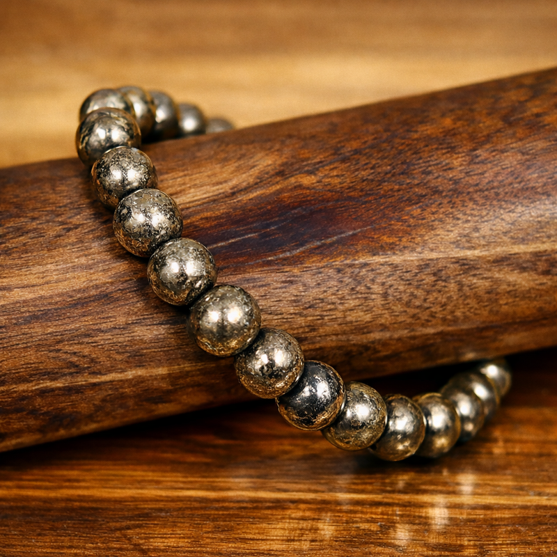 Luxury Pyrite Money Magnet Bracelet close-up on wooden background with premium gold shine