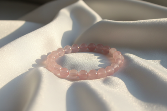 Rose Quartz Love Natural Crystal Bracelet on silky white cloth