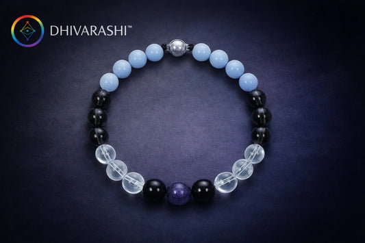 Shani Raksha crystal bracelet with black tourmaline, clear quartz, amethyst and blue lace agate beads on a dark background